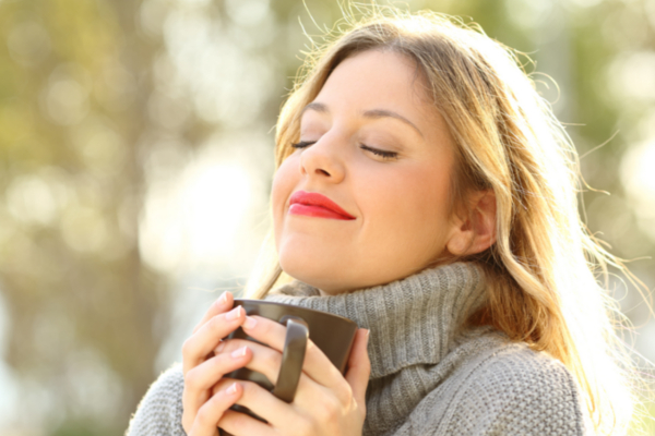 woman breathing fresh air outdoors