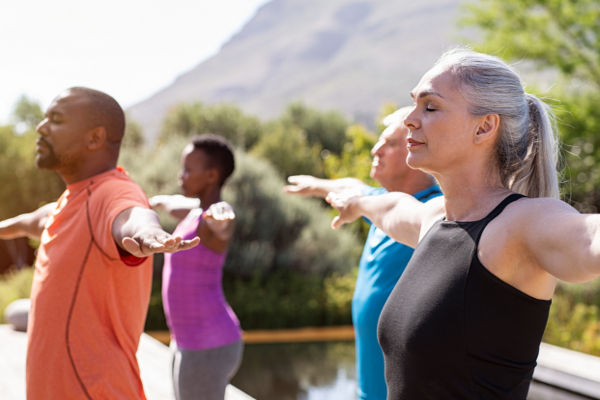 group of people practicing meditation