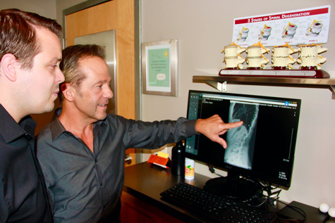 doctors looking at digital x-ray