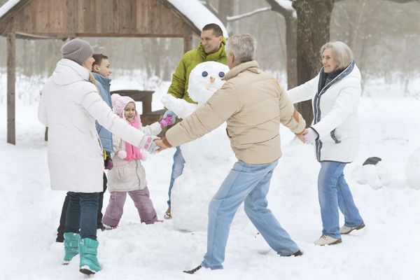family having fun in the snow